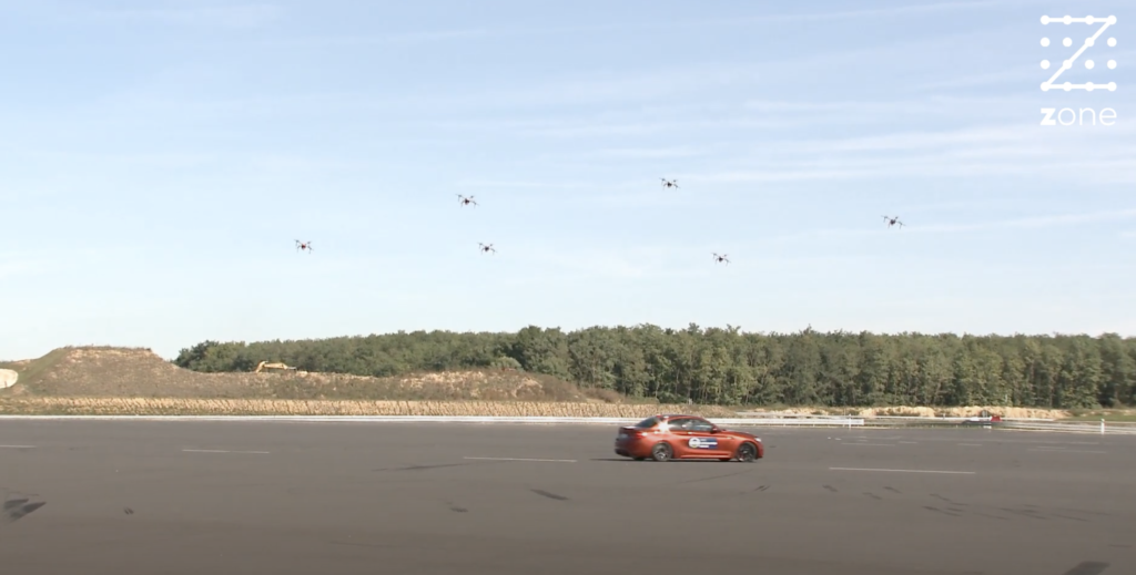 Autonomous drone swarm and drifting car in perfect harmony