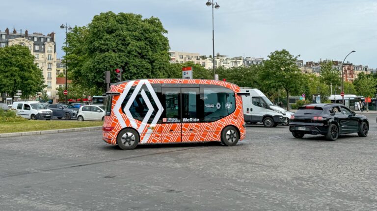 WeRide and Renault robobus driving on the road.