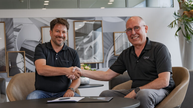 QNX and Vector sign MoU to launch a foundational vehicle software platform Dr Matthias Traub (Vector), left, and John Wall (QNX), right, during the signing of the memorandum of understanding.