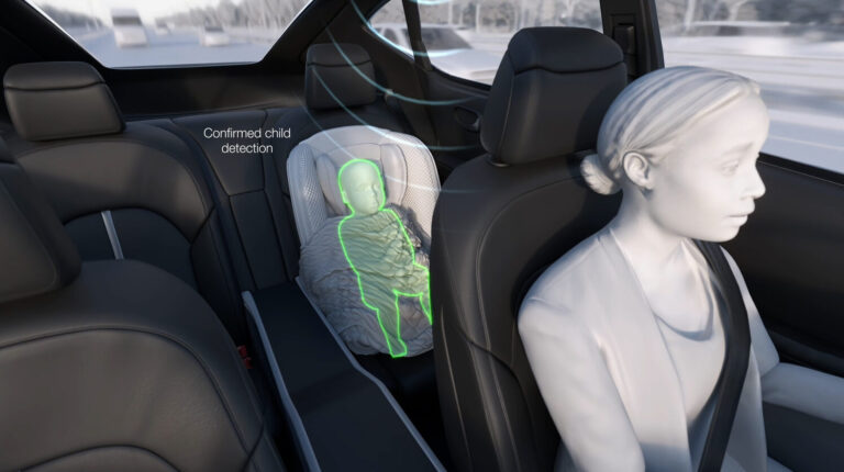 An image from a Magna in-cabin safety system showing the driver and a child in a car seat in the second row