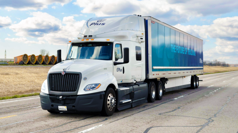 EXPO INTERVIEW: Anurag Paul and Inderjot Saggu, staff research engineers at Plus A MAN International truck on a highway with clouds in the sky.