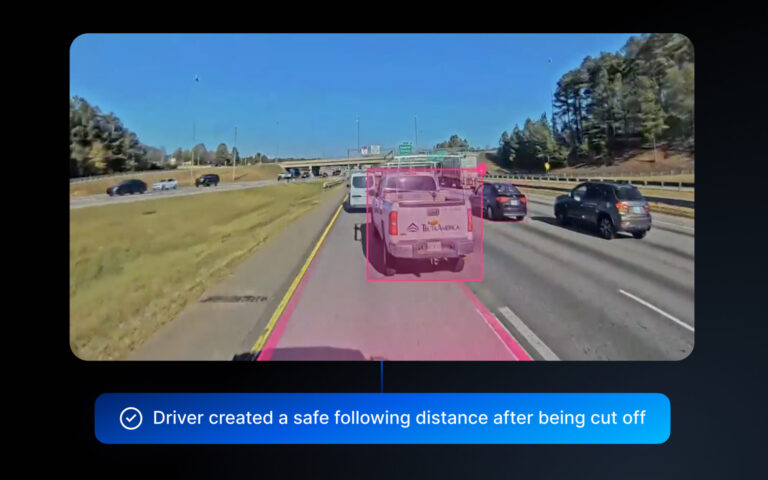 Screenshot of Motive's Positive Driving AI showing a vehicle on a highway surrounded by other vehicles, one of which is highlighted in pink.