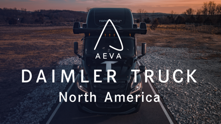 A Daimler truck on a rural highway at dusk, with "Aeva" and "Daimler Truck North America" written across the top of the image