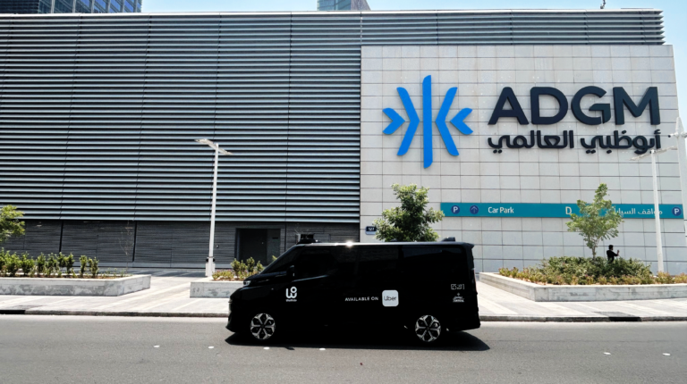 An Uber and WeRide robotaxi vehicle on a street in Abu Dhabi