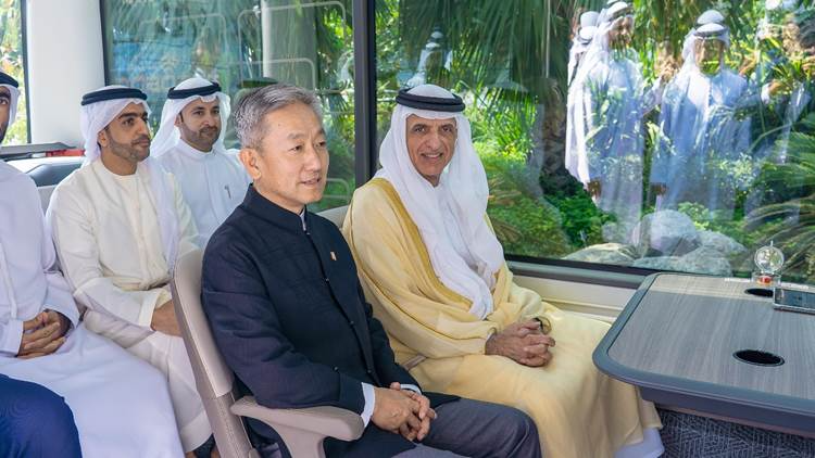 Sheikh Saud bin Saqr Al Qasimi, UAE Supreme Council member and Ruler of Ras Al Khaimah, and Zhang Yiming, Chinese ambassador to the UAE, riding WeRide's Robobus