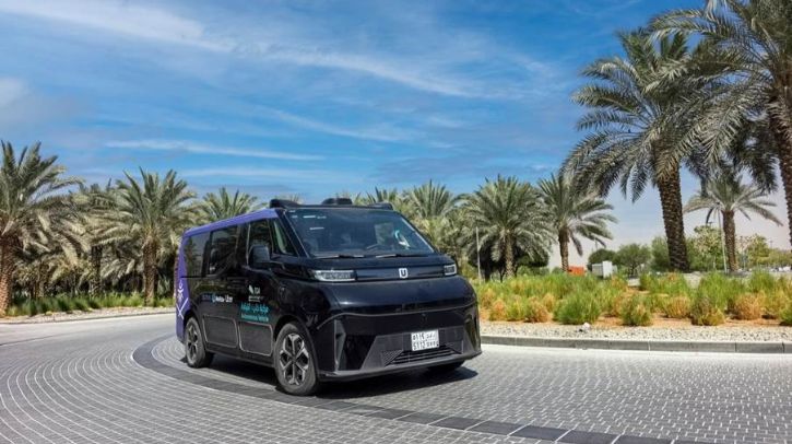 Uber and WeRide launch robotaxis in Saudi Arabia A WeRide robotaxi driving on the road, with a blue sky