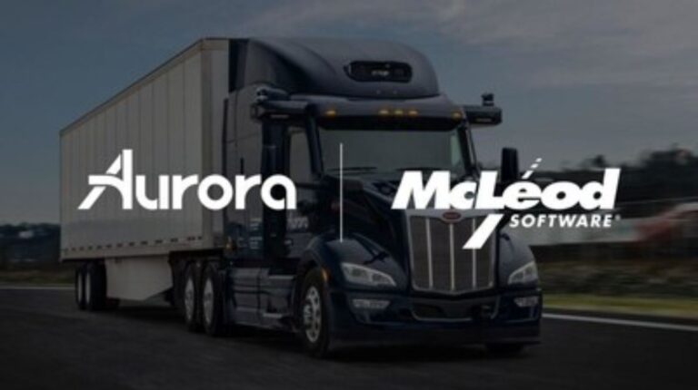Aurora and McLeod company logos on top of a darkened image of an autonomous truck driving on a quiet highway.