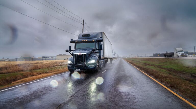 Aurora Innovation autonomous truck driving in rain.