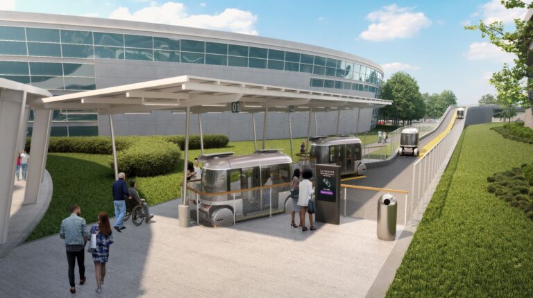 Glydways begins construction on first public autonomous transit in Atlanta An artist render of the new Glydways Atlanta autonomous public transit system, with passenger boarding an autonomous shuttle outside a large glass building.
