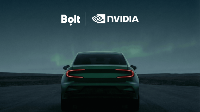Bolt and Nvidia logos above the silhouette of an autonomous vehicle at night-time.