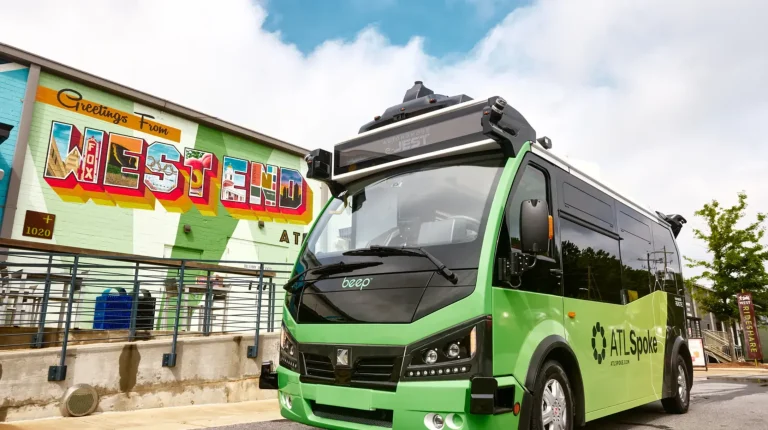 A green Beep AV bus.