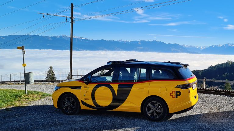 Baidu and Swiss Post announce autonomous driving trial in Switzerland A yellow AmiGo vehicle in operation on open roads in Eastern Switzerland.