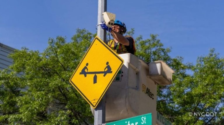 NYC DOT Traffic Operations worker installing a new Viva activity sensor in Greenpoint, Brooklyn.