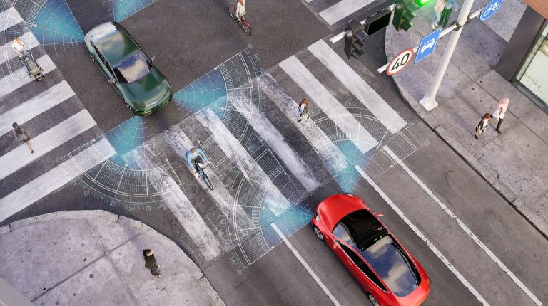 Digram in which a red connected vehicle approaches a four-way intersection.