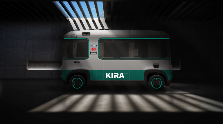 Holon joins project to help with AV operating area approval bottlenecks A green and white KIRA+ project autonomous vehicle in a parking lot.